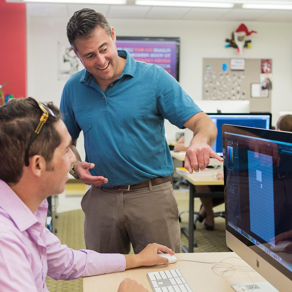 Student and Instructor at computer